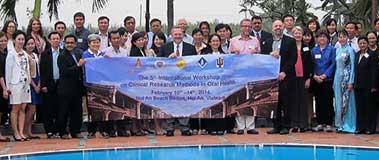 Group with banner at poolside