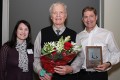 Dr. Richard McCoy receives the Bruce R. Rothwell Lifetime Distinguished Teacher Award from Dr. Mark Drangsholt and Rebecca Rothwell.