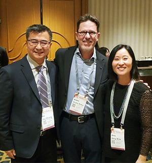 Dean Ritter congratulates Drs. Kim and Zhang on their graduation from the ADEA Leadership Institute.