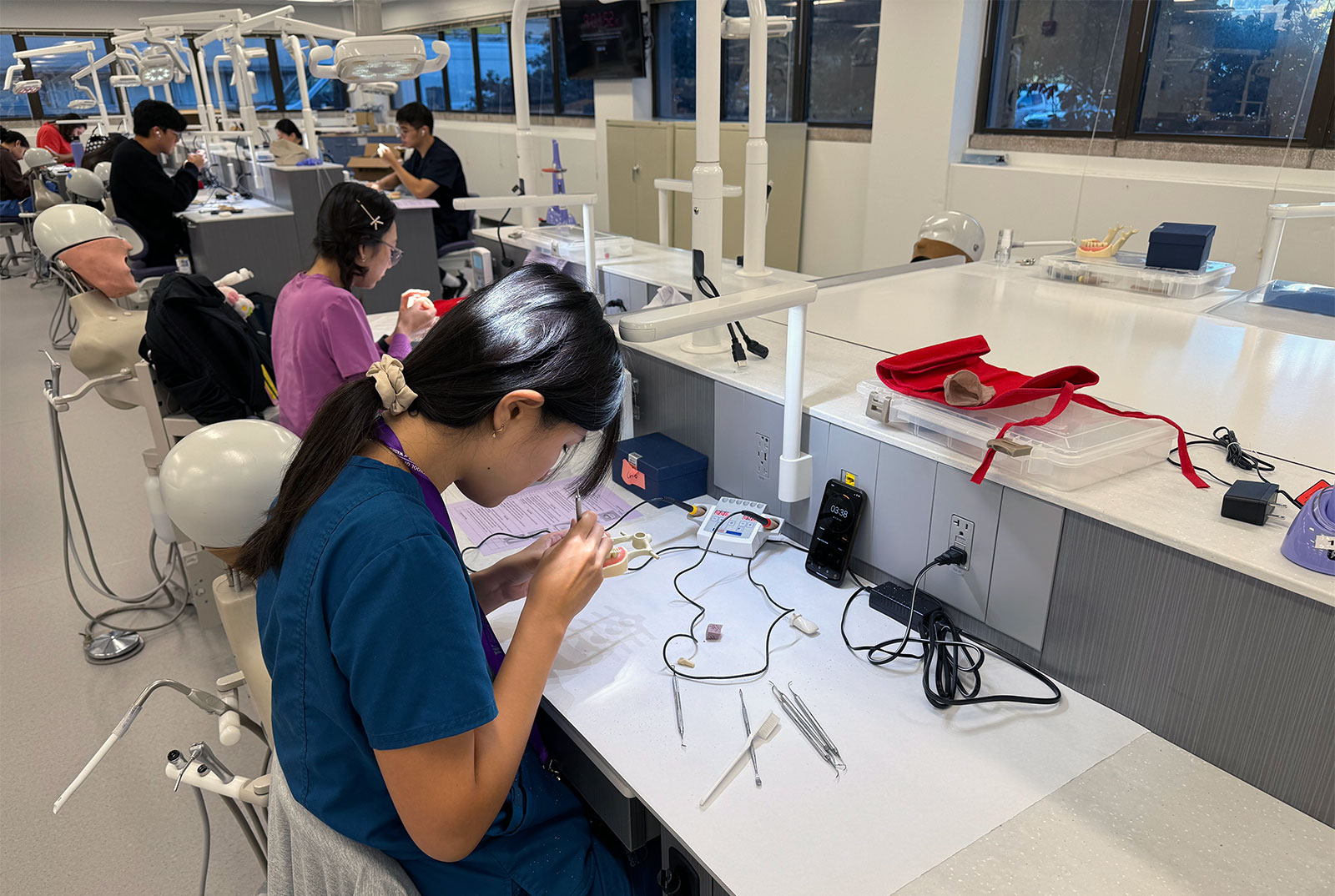 Student working at a station in the D165 Sim Lab.