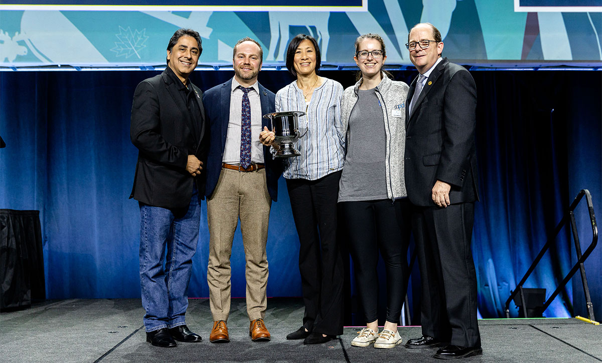 Dr. Randall accepting the Suzi Seale Coll Award with members of his Workgroup