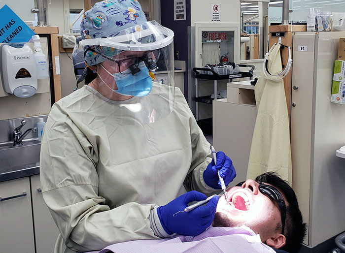 Shoreline Community College dental hygiene student Anela Becic treats a patient in the School of Dentistry’s pre-doctoral clinic. Shoreline Community College dental hygiene student Anela Becic treats a patient in the School of Dentistry’s pre-doctoral clinic. 