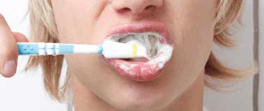 child's mouth with toothbrush