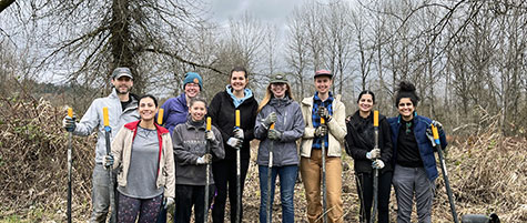 CAST team members planting trees on the Snoqualmie riverbank at an ‘Adopt-a-buffer event.