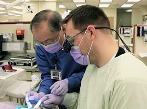 Dr. Chung and Levi Reynolds treat a patient