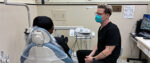 UWSOD student talks with a patient referred to the School by the KCADP.