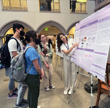 Natalie presenting her research to fellow undergraduate students in Mary Gates Hall.