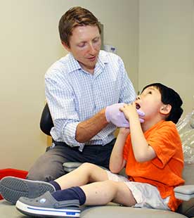 Dr. Nelson examines child's mouth