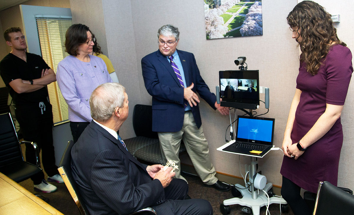 Dr. Frank Roberts showcases teledentistry technology to Secretary Vilsack during the Rural Health Discussion Panel.