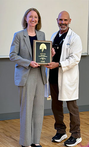 Dr. Grant receiving Wands Award