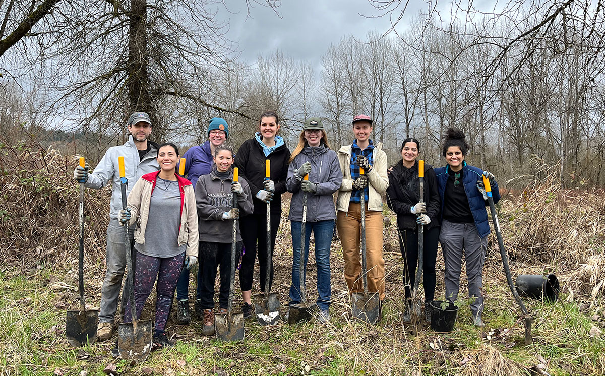 CAST team members planting trees on the Snoqualmie riverbank at an ‘Adopt-a-buffer event.