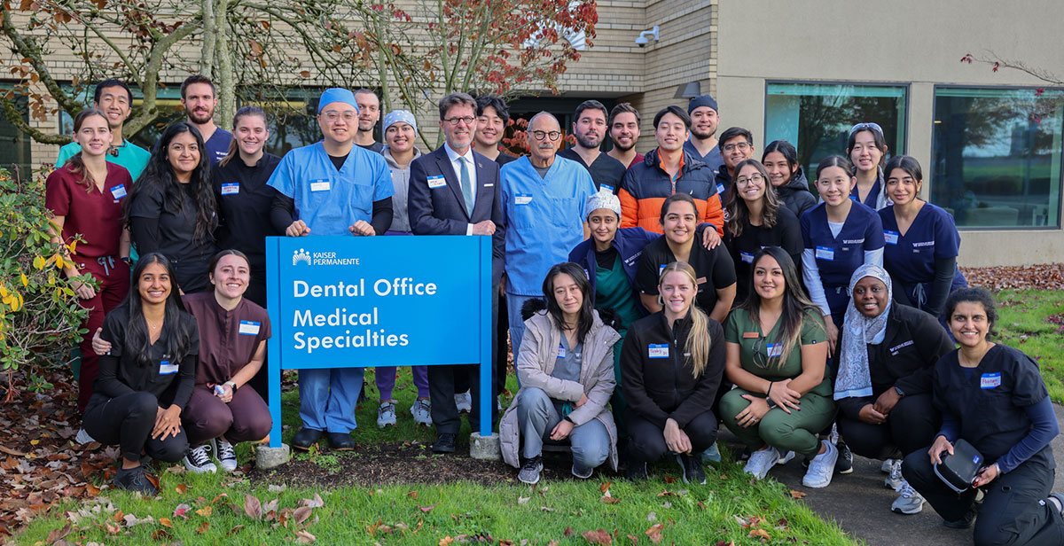 Group of faculty and students outside buiding