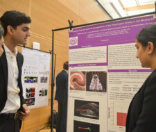 student with poster