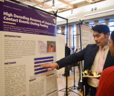 student with poster