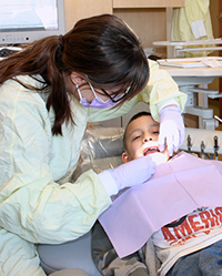 Resident dentist with young patient