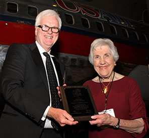 Dr. Doris Stiefel receives her Honorary Lifetime Member Award from Dr. David Minahan of the Dean’s Club board of trustees. 