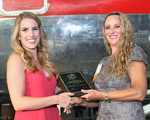 Stephanie Campbell receives her award from Dr. Sarah Fraker, president of the Dean’s Club.