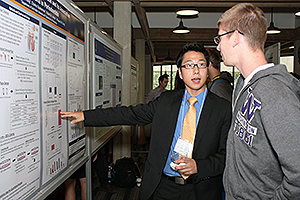 Jonathan An describes his study to fellow second-year student Chase Talbot. 