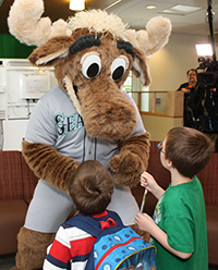 Mariner Moose entertains a couple of young fans.