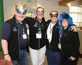 American Academy of Pediatric Dentistry volunteers Drs. Jim Nickman, Ron Kosinski, Stacy Weedon and Angela Stout have fun at the photo booth.