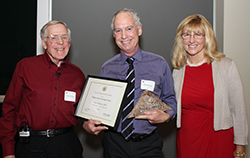 Dr. Philip Anderson receives the Hungate Award for Teaching Excellence from Dr. Charles Bolender and Marilynn Hungate. 