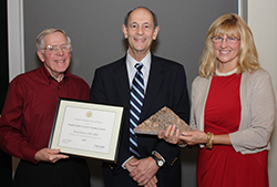 Dr. David Steiner receives the Hungate Lifetime Award for Teaching Excellence from Dr. Charles Bolender and Marilynn Hungate. 