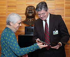 Norma Wells receives her award from Stephen Zieniewicz, Executive Director of the UW Medical Center.