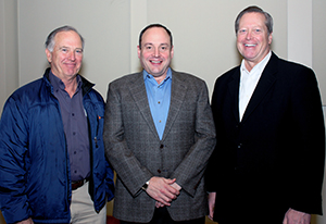 At the School’s faculty retreat on Dec. 14, Dean Berg (center) joins Dr. David Branch (left), chair of the Delta Dental/Washington Dental Service board of directors, and Jim Dwyer, DD/WDS president and CEO.