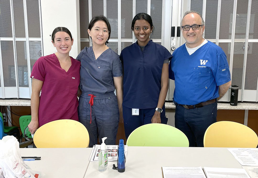 Merissa Delazerda (D3), Su Young Kim (D2), Divya Kannappan (D3) and Dr. Andy Marashi prepare to provide dental screen-ing and referral services to clients of Mercy Housing in Seattle.
