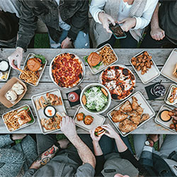 people eating a meal around a table
