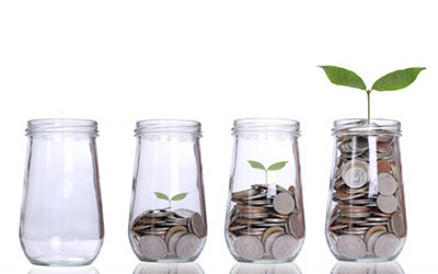 mason jars of coins and one seedling