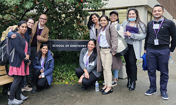 Class of 2026 IDDS students in front of UW SOD sign