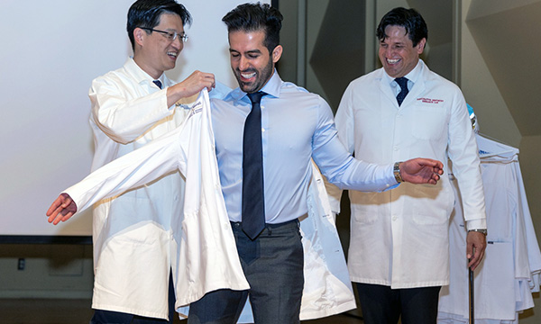 Student getting white coat