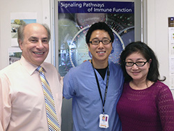 Jonathan An (center) celebrates his award with faculty members Dr. Robert London and Dr. Sun Oh Chung.