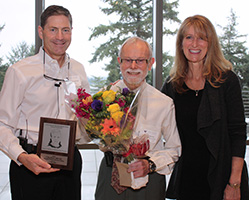 Dr. O. Ross Beirne (center) receives the Bruce R. Rothwell Lifetime Achievement Award from Dr. Mark Drangsholt and Dr. Patricia Rothwell.