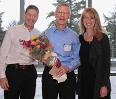 Dr. Glen Johnson (center) receives the Bruce R. Rothwell Distinguished Teacher Award from Dr. Mark Drangsholt and Dr. Patricia Rothwell.