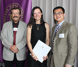 Dr. Mats Kronstrom (left) and Dr. Hai Zhang congratulate Anisoara Begun, winner of the Dr. William S. Kramer Award of Excellence.