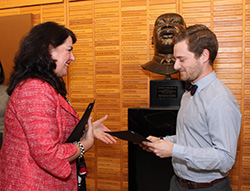 Patricia Riley, senior associate administrator of the University of Washington Medical Center, presents David Ludwig with the Community Volunteer Recognition Award.